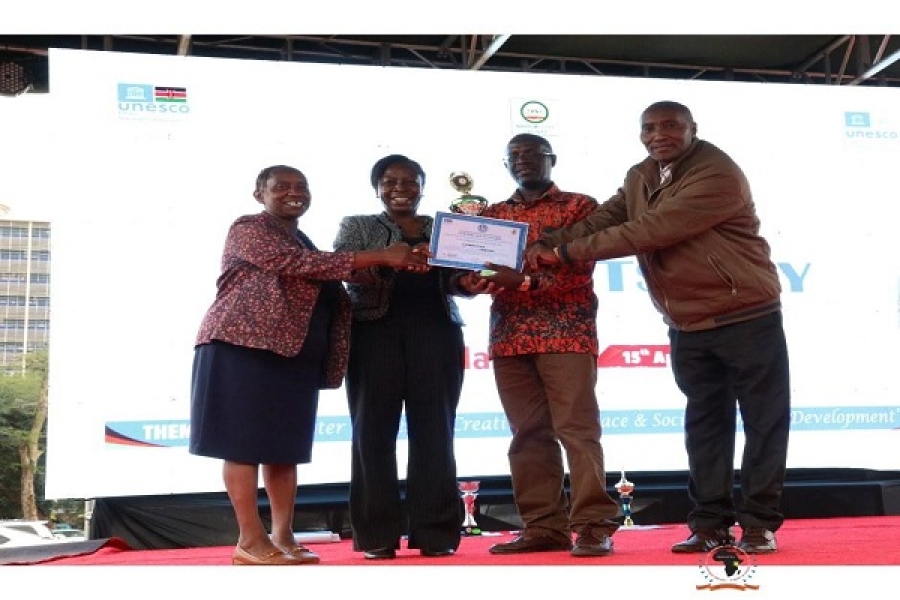 CEMASTEA staff led by the C.E.O Mrs. Jacinta L. Akatsa, HSC poses with the certificate and the trophy after scoping the 1st position during the Kenya National Commission for UNESCO (KNATCOM) 10th Anniversary in April, 2023