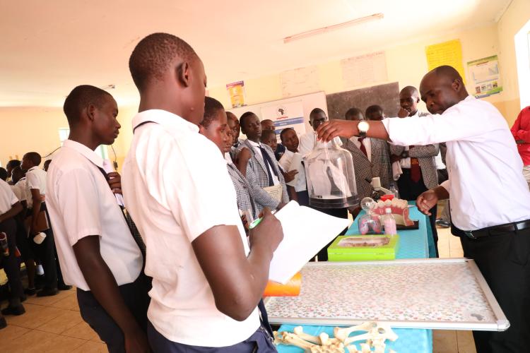 Mr. Paul Akoko demonstrating to the learners at Bishop Abiero Shauri Moyo Secondary in Kisumu County how the breathing system works during the STEM outreach