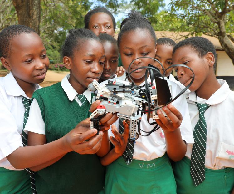 Students at Mulango Girls High School in Kitui County learn how to assemble and operate a robot during a STEM mentorship program organized by CEMASTEA to mark the International Day for Women and Girls in Science.