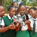 Students at Mulango Girls High School in Kitui County learn how to assemble and operate a robot during a STEM mentorship program organized by CEMASTEA to mark the International Day for Women and Girls in Science.